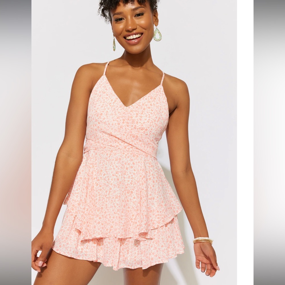 Brand new Francesca’s white/orange romper.